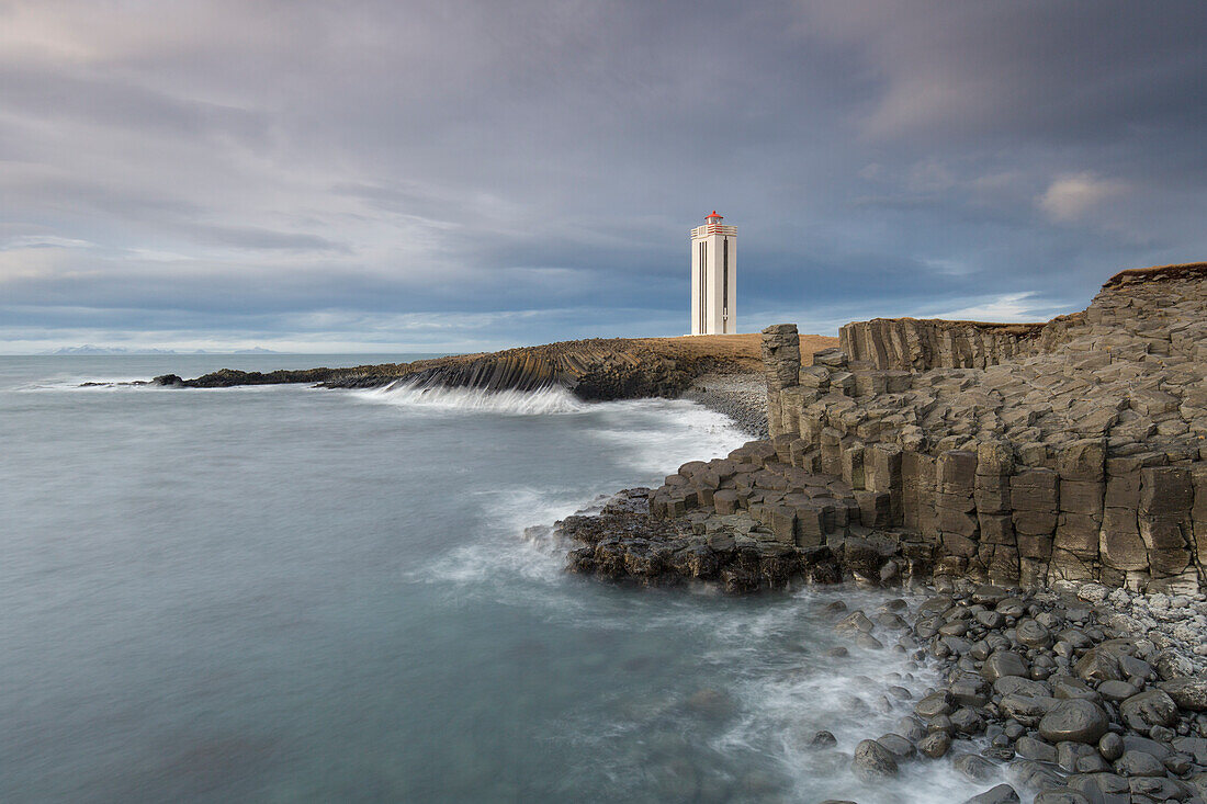  Kalfshamarsvik lighthouse surrounded by basalt rocks, Skagi Peninsula, Iceland 