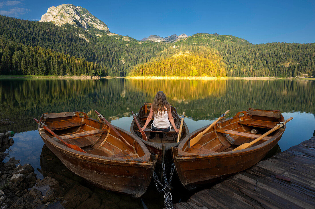  Wooden rowing boats with model at sunrise, Black Lake, Crno Jezero, Durmitor Mountains, natural landscape, landscape Durmitor National Park near town Žabljak, Montenegro 