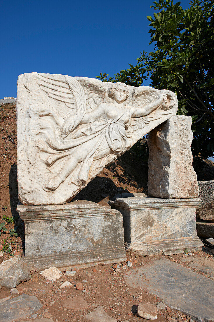 Stone relief depicting Nike, the Greek goddess of victory in the ancient city of Ephesus, a UNESCO World Heritage Site. Izmir Province, Turkey.