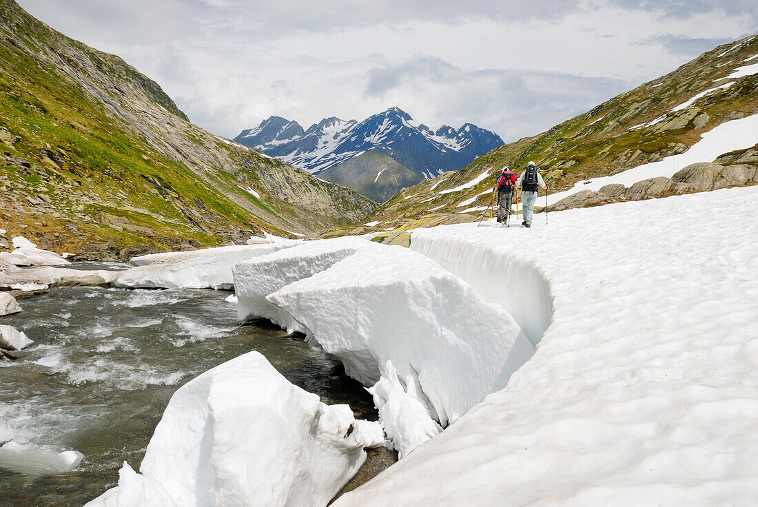 trekkers along the Reno di Medels river,Val Piora,Canton Ticino,Switzerland,Europe