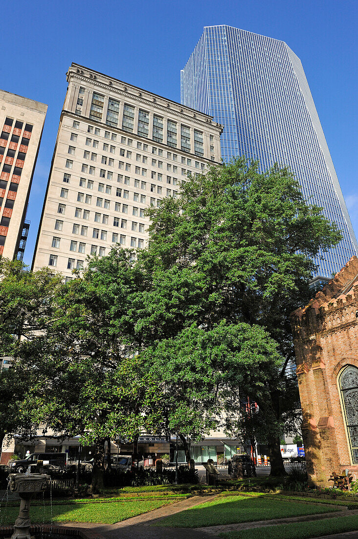 Christ Church Cathedral's garden with Magnolia Hotel in the background, downtown Houston, Texas, United States of America, North America