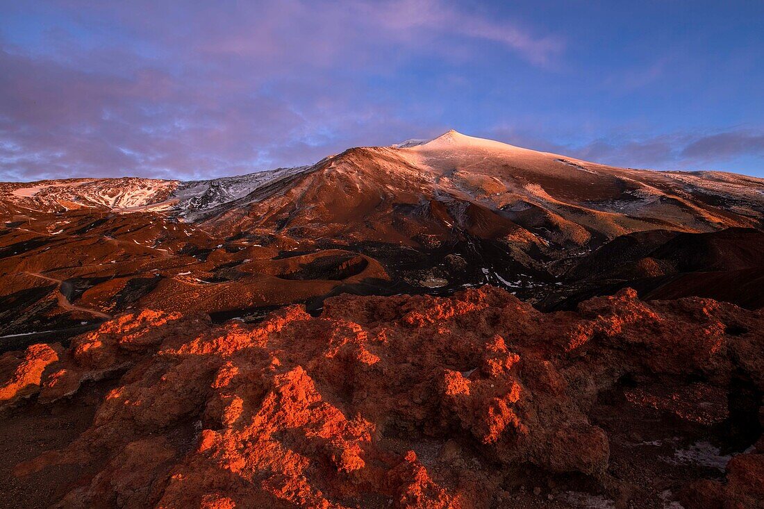  View of the summit crater and secondary craters of Mount Etna at blue hour and sunrise, UNESCO World Heritage Volcano, stratovolcano, Mount Etna, Italy, Sicily,\n 