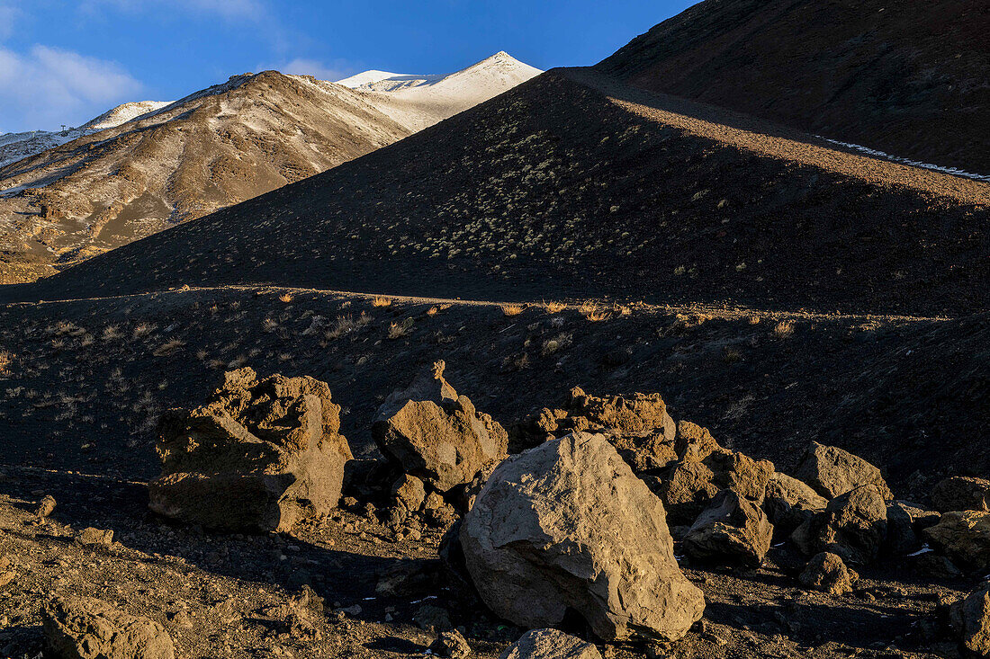  Light and shadow on the summit crater and secondary craters of Mount Etna at blue hour and sunrise, Silvestri crater, Piccolo cratere sud dell&#39;Etna, UNESCO World Heritage volcano, stratovolcano, Mount Etna, Etna, Italy, Sicily\n 