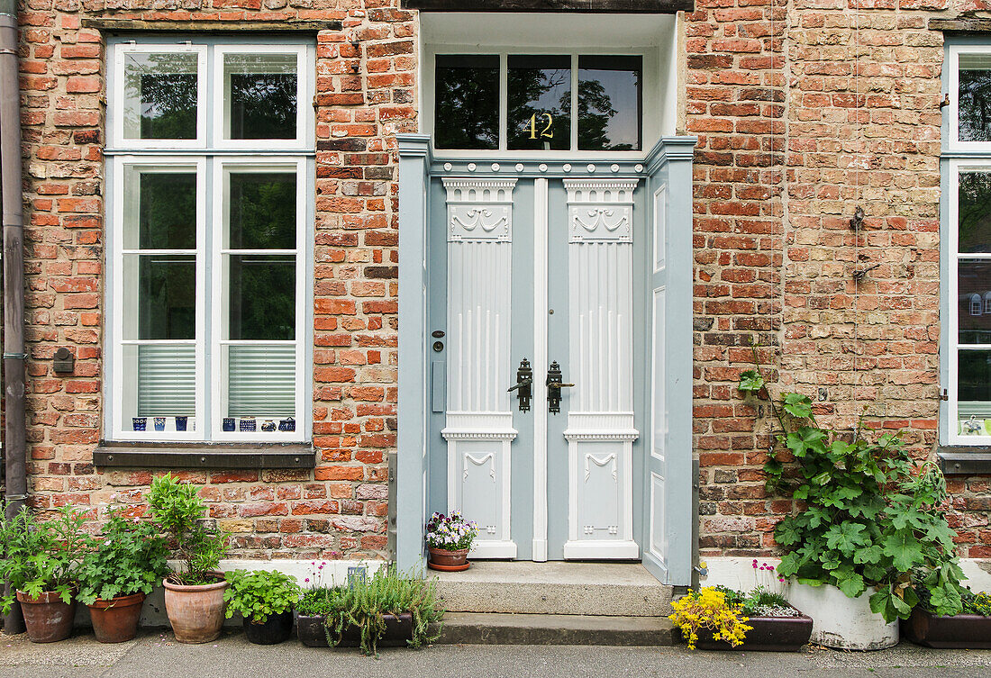  Green entrance to a brick house 