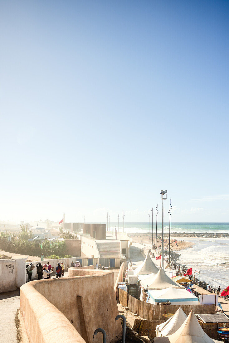  Rabat beach at high tide, with lots of surfers, high waves and at lunchtime in Rabat, Morocco. 