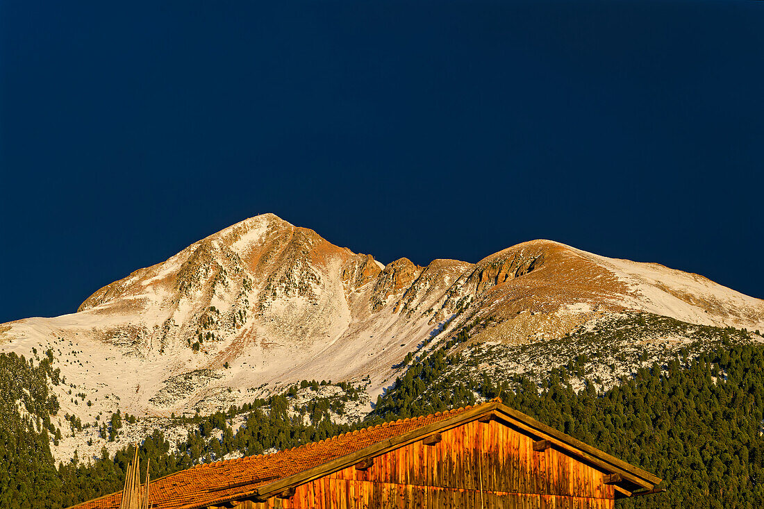  The mountain Schwarzhorn after snowfall in the sunset light, Aldein, South Tyrol, Alto Adige, Italy 