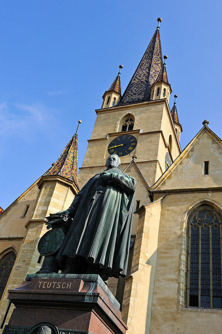 statue of the Bishop Teutsch beside the Evangelical Lutheran Cathedral on Huet Square,upper and old town,Sibiu,Transylvania,Romania,Southeastern and Central Europe