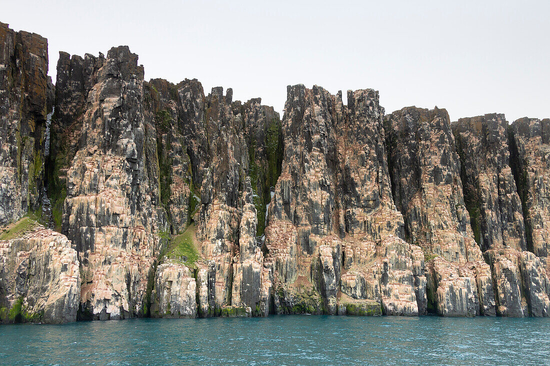  Basalt cliffs of the bird cliff Alkefjellet, Spitsbergen, Norway 