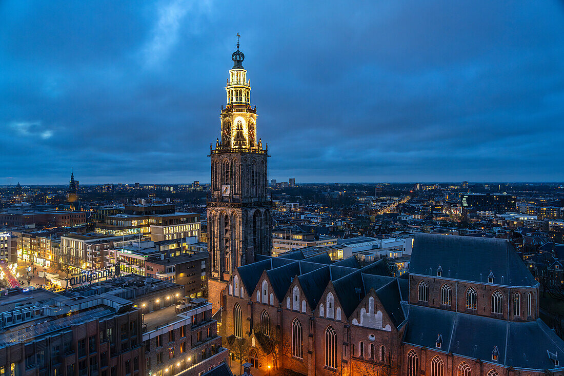  The church tower Martinitoren or Martini Tower of the Martinikerk or Martini Church seen from above at dusk, Groningen, Netherlands  