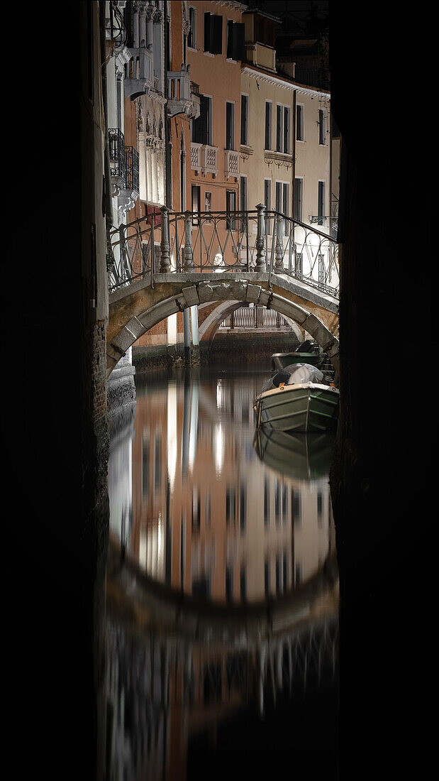  View of Venetian facades with bridge at night on a canal in San Marco, Venice, Veneto, Italy, Europe 