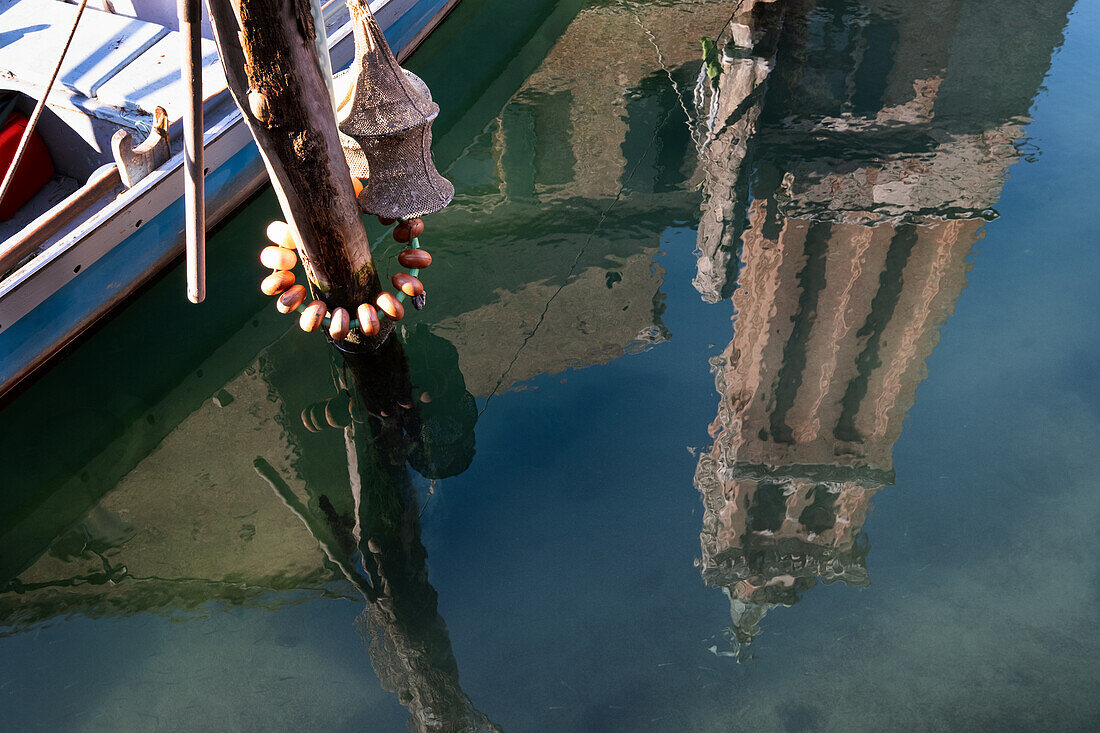  View of the reflection of the bell tower of the Cathedral of Santa Maria Assunta, Cathedral of Chioggia, Vena Canal, Chioggia, Lagoon, Veneto, Italy 