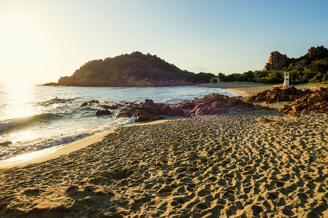  Lonely picturesque beach and red rocks, Spiaggia Su Sirboni, sunrise, near Tertenia, Ogliastra province, Sardinia, Italy 