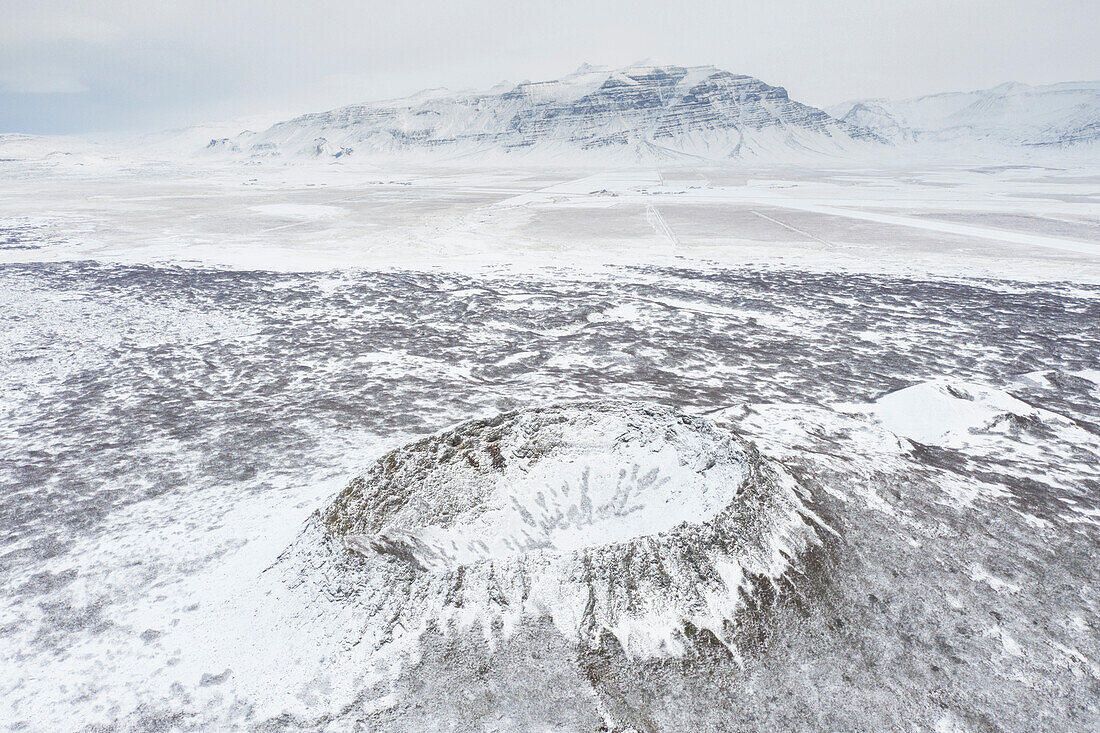  View of the Eldborg crater in the snow, Snaefellsnes, Iceland 