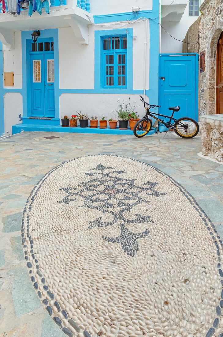 Traditional pebble mosaic of Mandraki old town, Mandraki, Nisyros Island, Dodecanese Islands, Greece