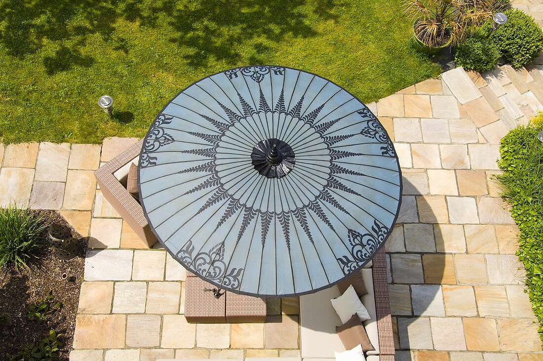 A view of a grey sunshade on a terrace