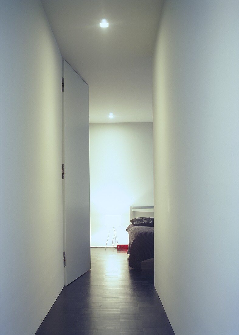 A view along a corridor into a bedroom
