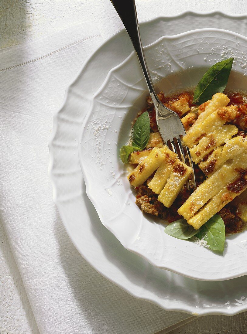 Polenta pasticciata (polenta with meat sauce, Italy)