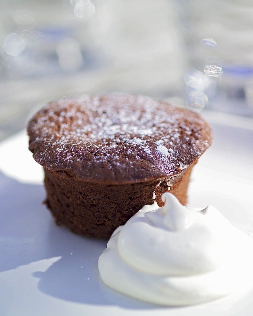 Chocolate muffin with whipped cream