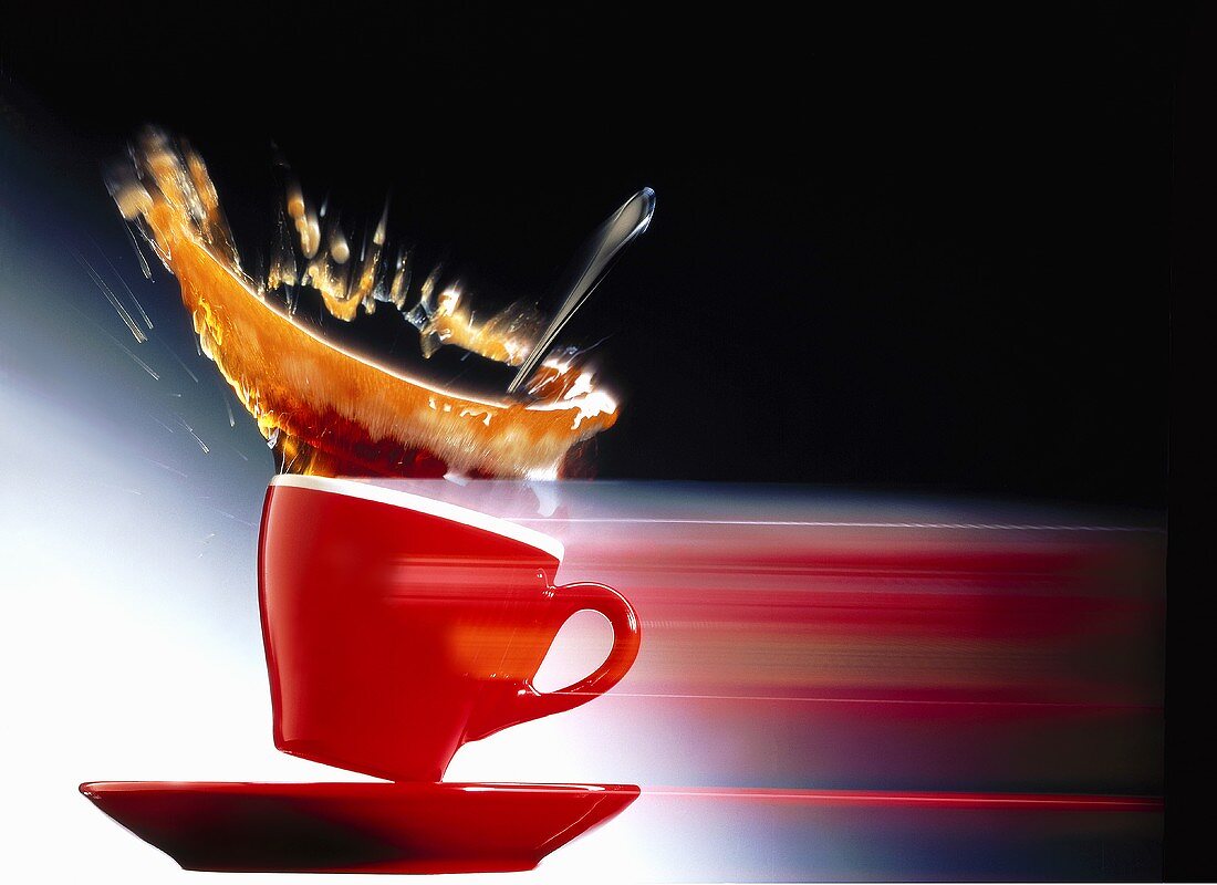 Espresso splashing out of a cup