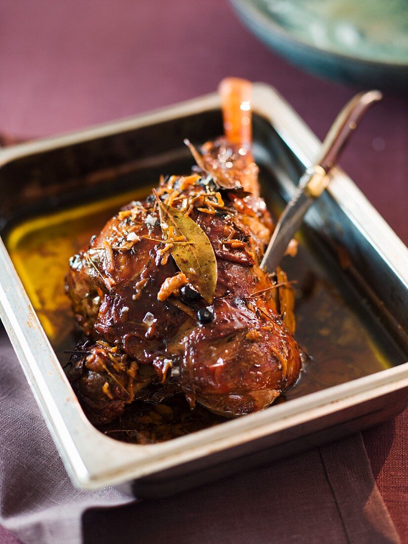 Leg of lamb braised in spiced olive oil