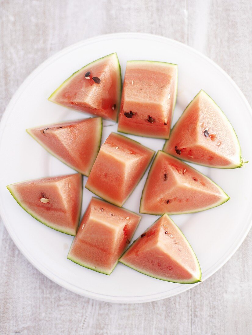 Pieces of watermelon on plate from above