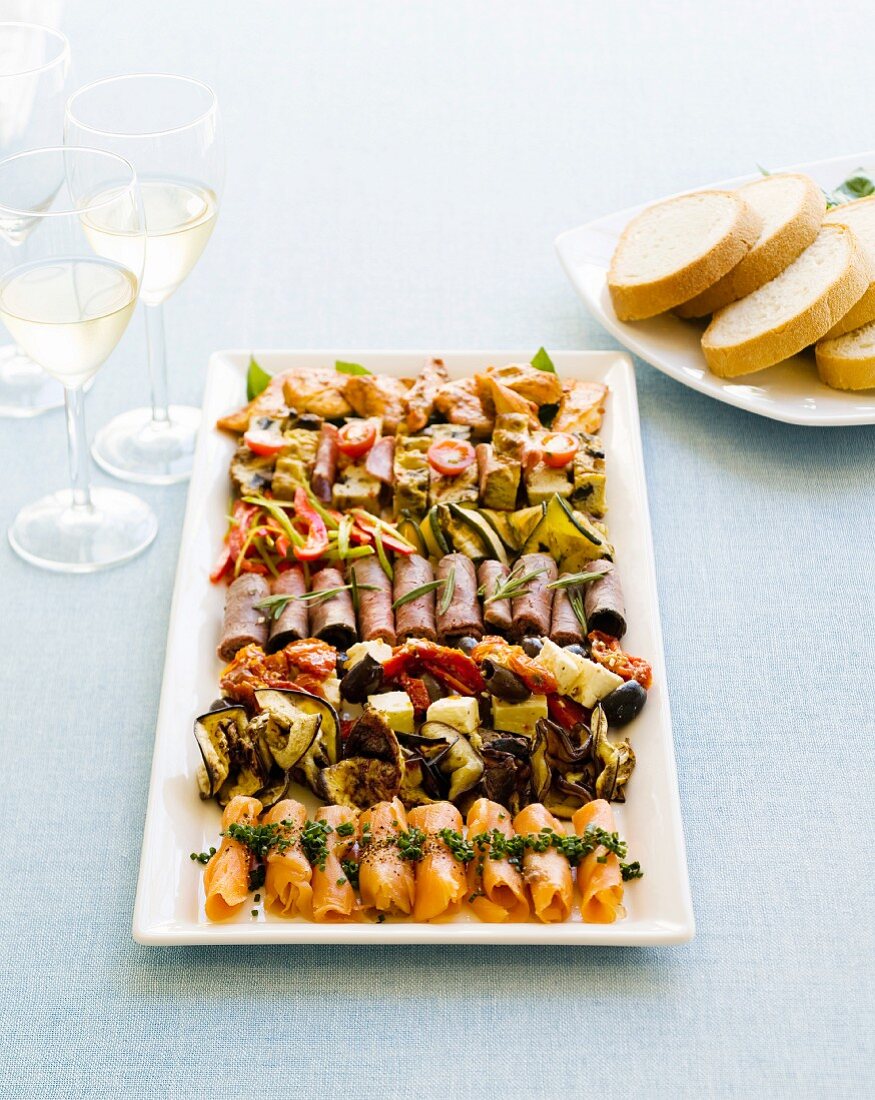 Mezze platter with white wine and white bread