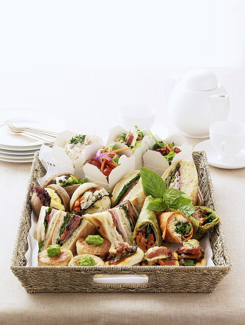 Assorted sandwiches and wraps in a basket