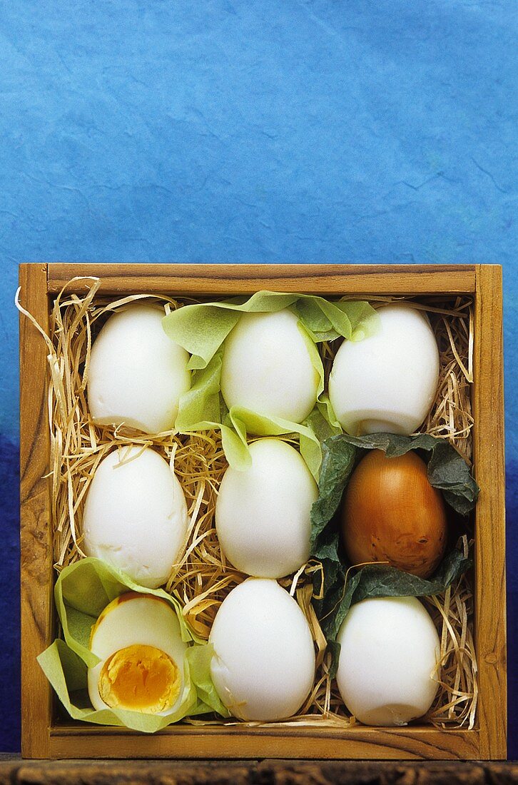 Hard-boiled eggs in wooden box