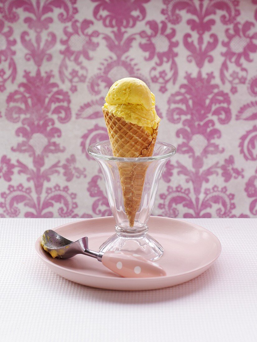 Mango sorbet in a cone