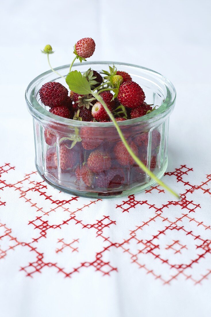 Woodland strawberries in a glass bowl