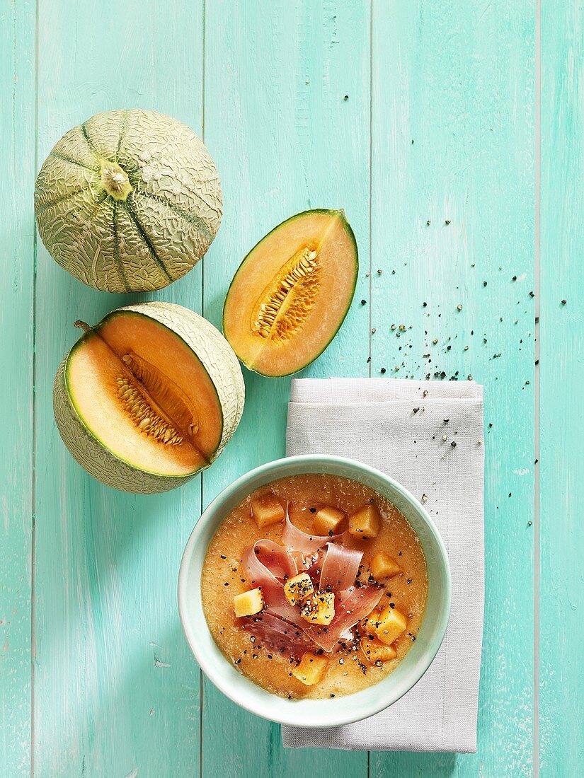 Cold cantaloupe melon soup with sliced ham