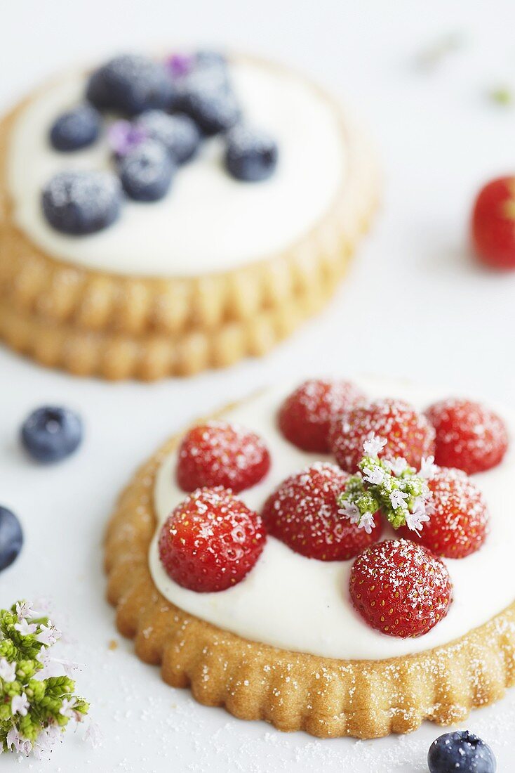 Strawberry tartlets and blueberry tartlets