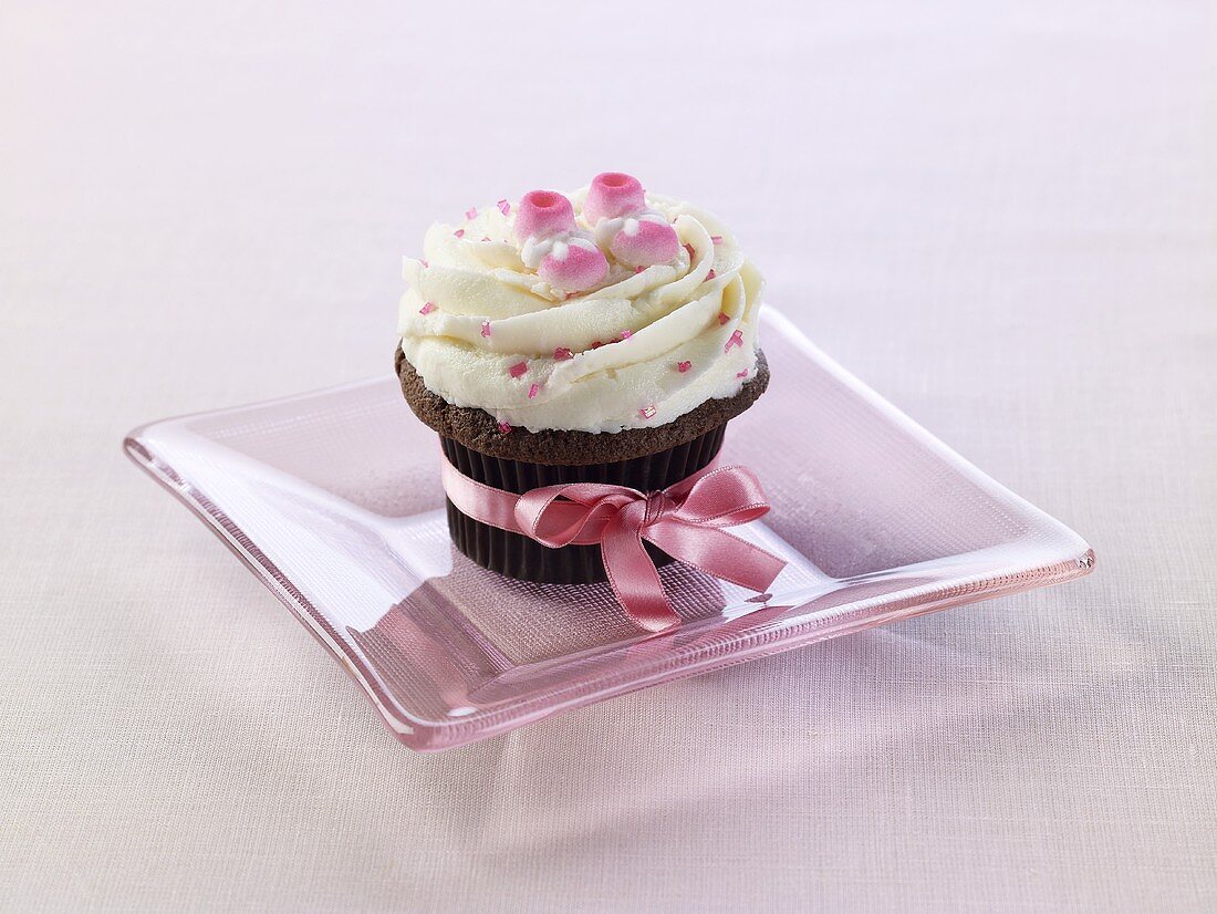 Cupcake mit rosa Schleife