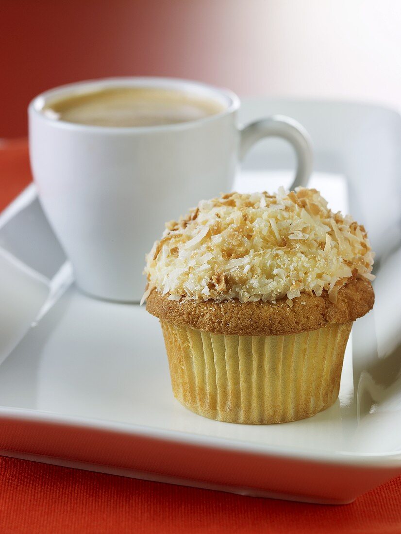 A cupcake and an espresso cup