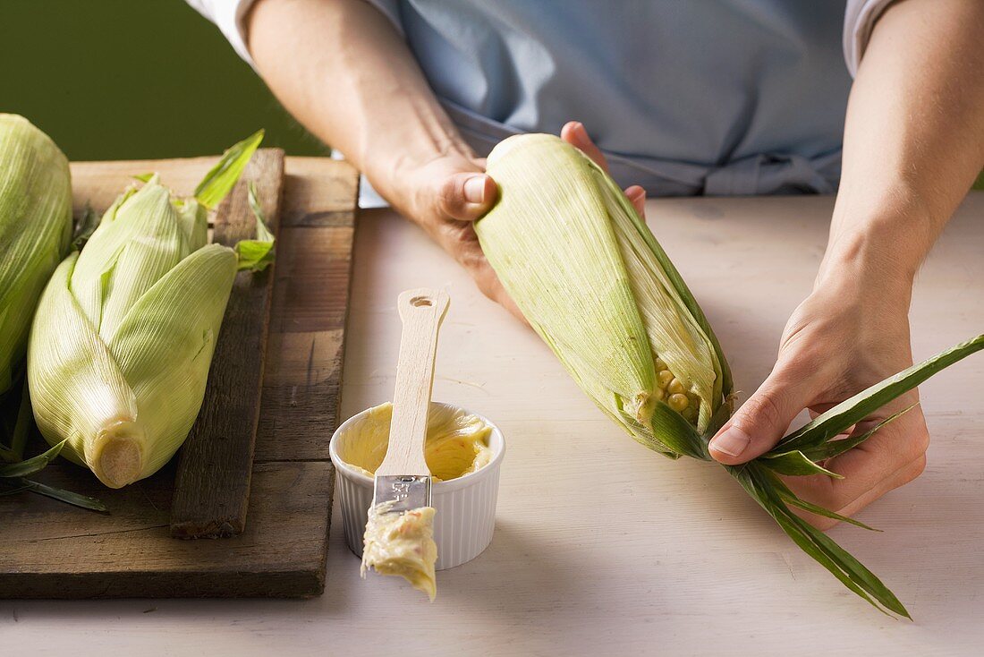 Corn on the cob being prepared for the barbeque