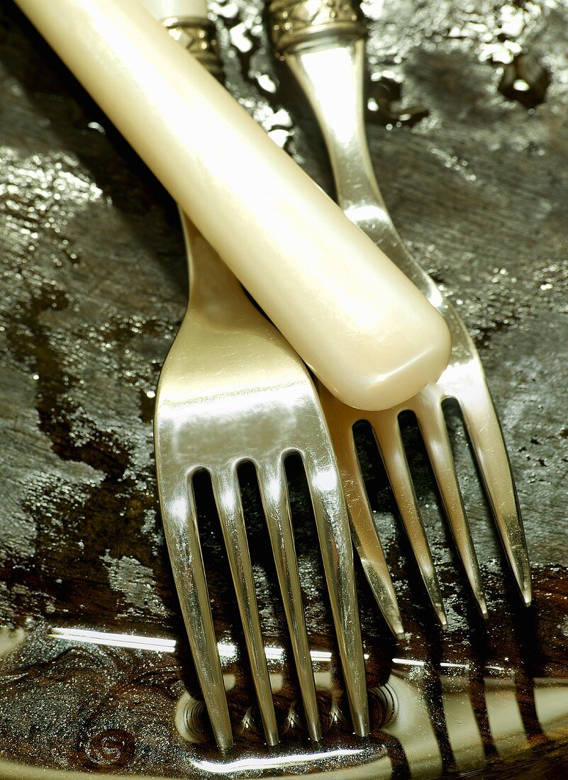 Forks on a wooden surface