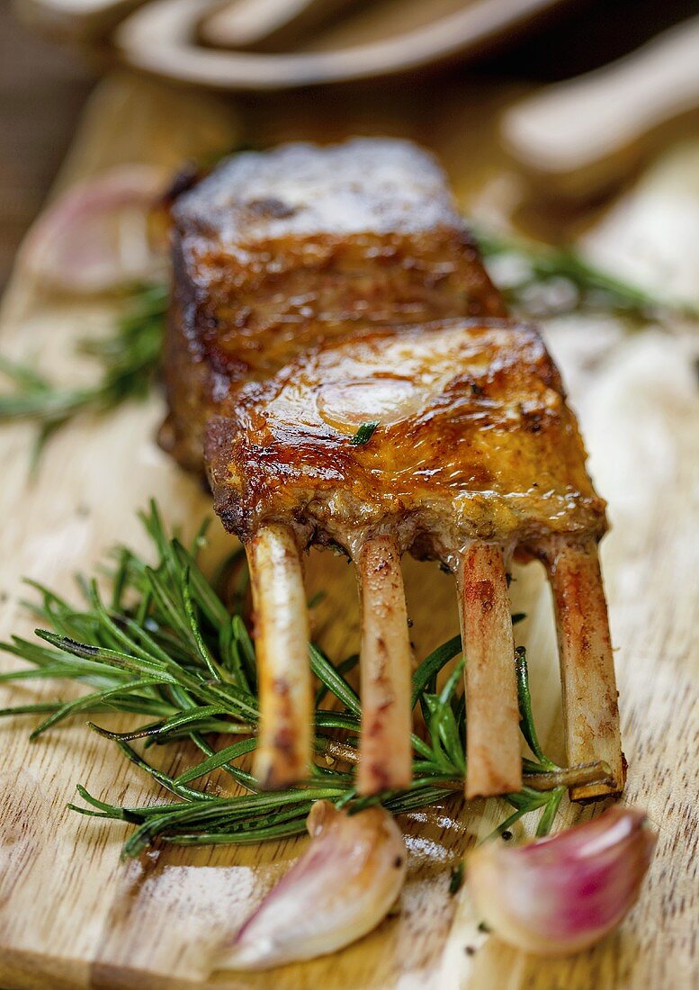 A grilled rack of lamb with rosemary and garlic