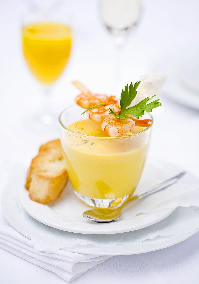 Coconut and mango soup with a prawn kebab