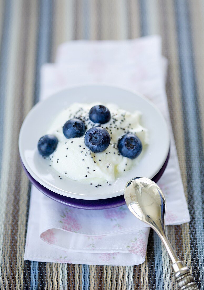 Blueberries in yoghurt with poppy seeds