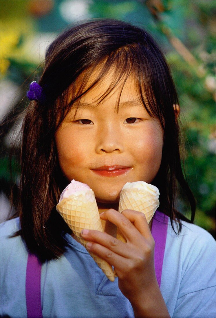 Young Girl Eating Two Ice Cream Cones