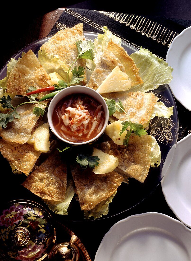 Pieces of rice paper biscuits; Glass plate