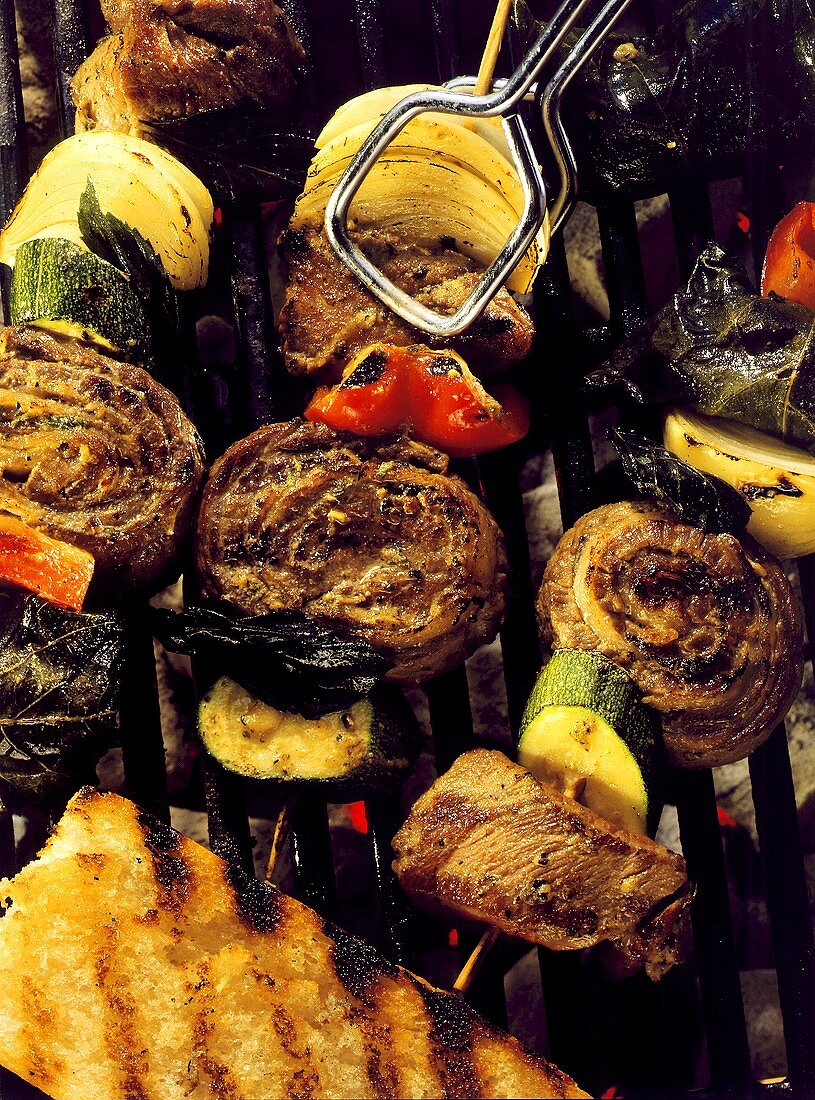 Meat Skewers on Grill with Vegetables