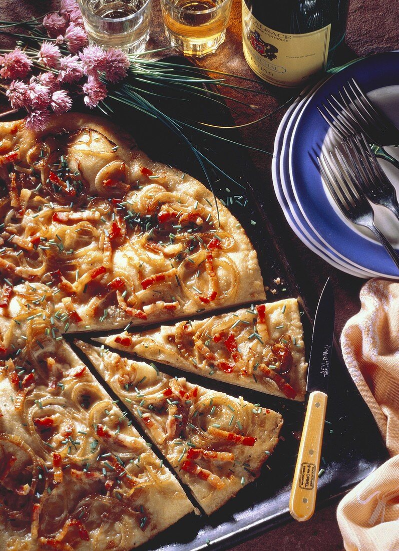 Alsatian onion pizza on baking tray