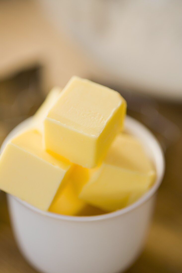 Several butter cubes in small bowl