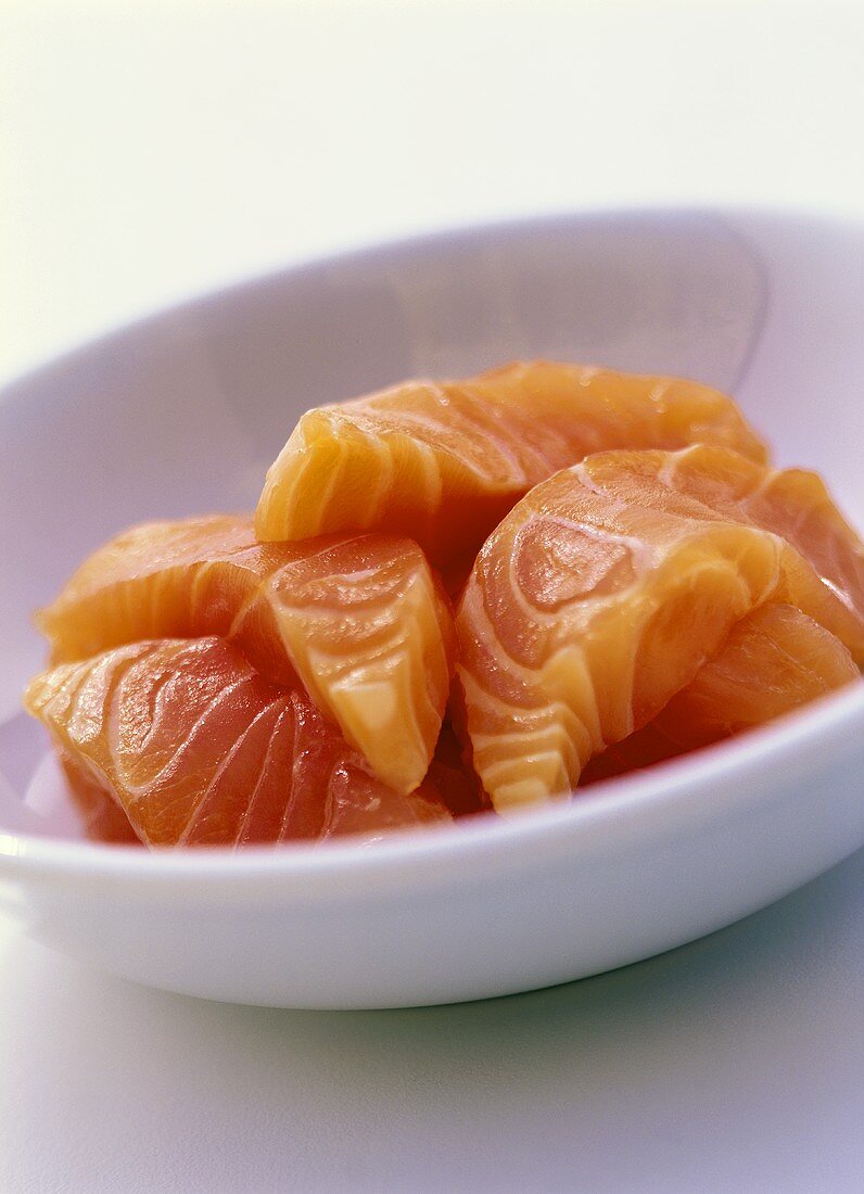 Fresh salmon fillet on white plate