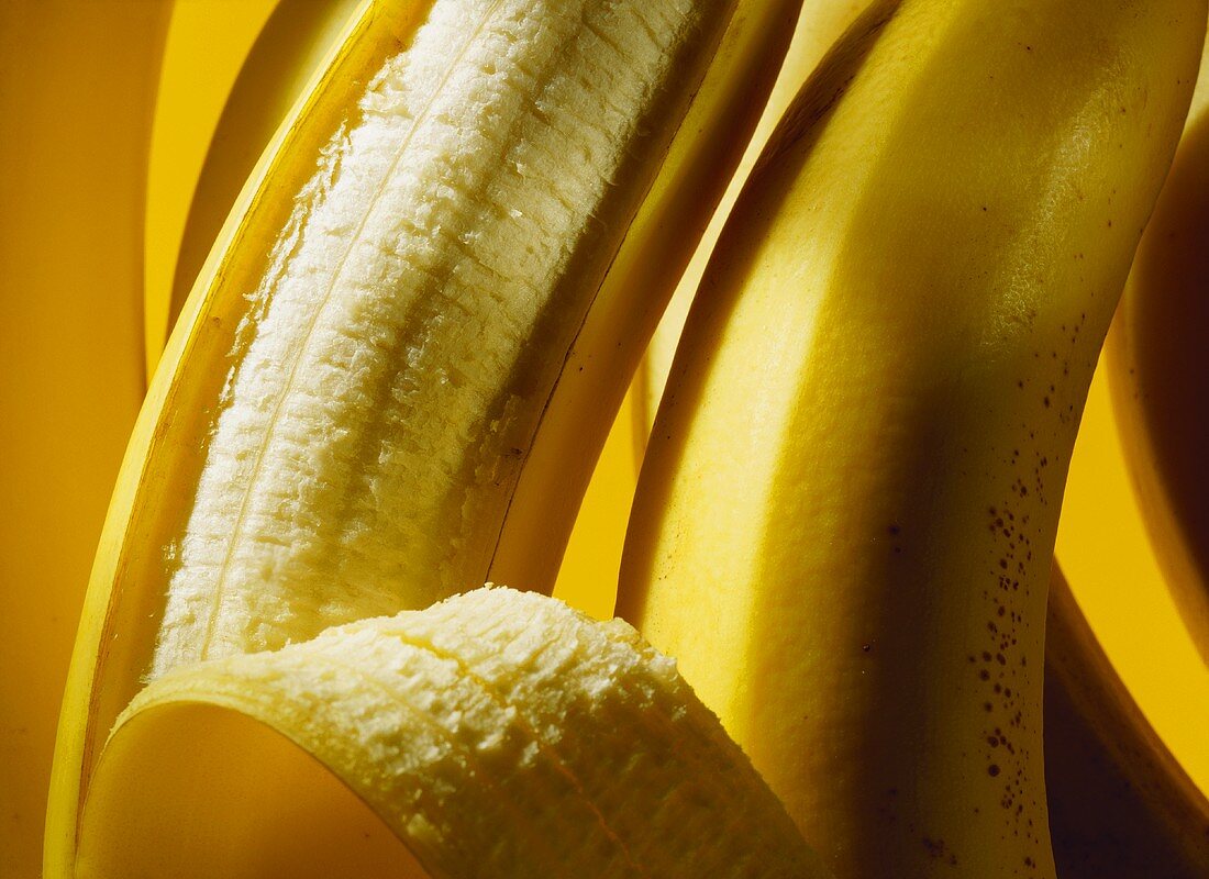 Bananas, one half-peeled