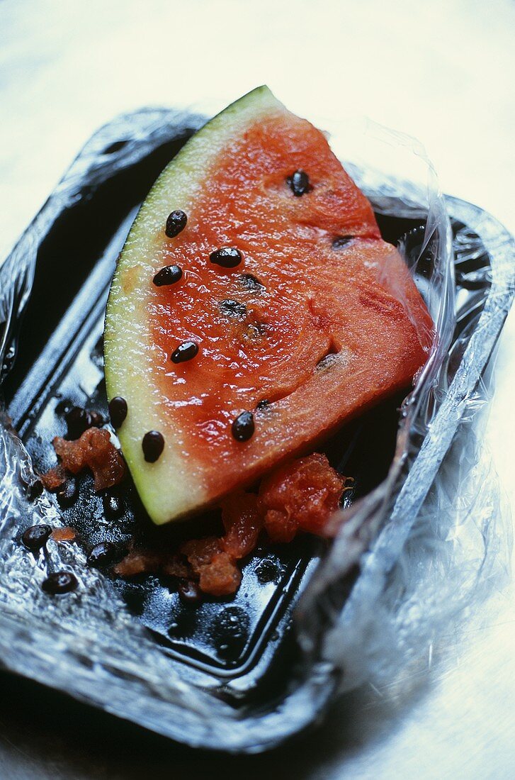 Slice of watermelon in plastic container