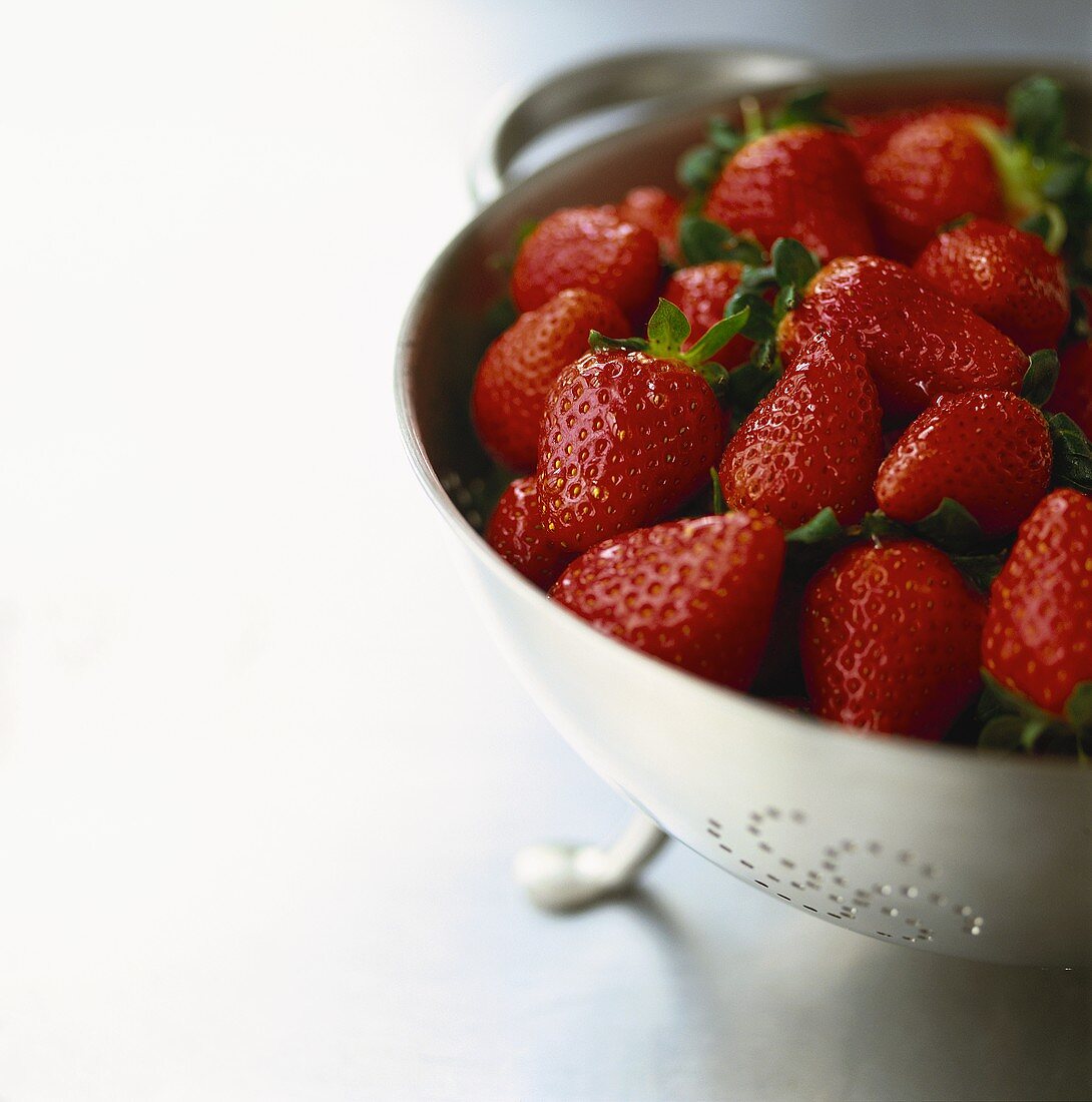 Lots of strawberries in sieve