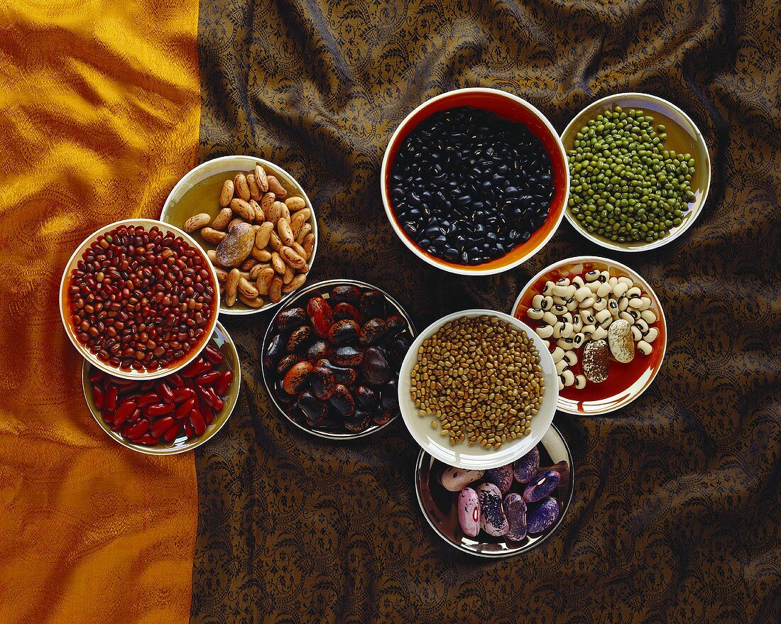 Different types of beans in bowls