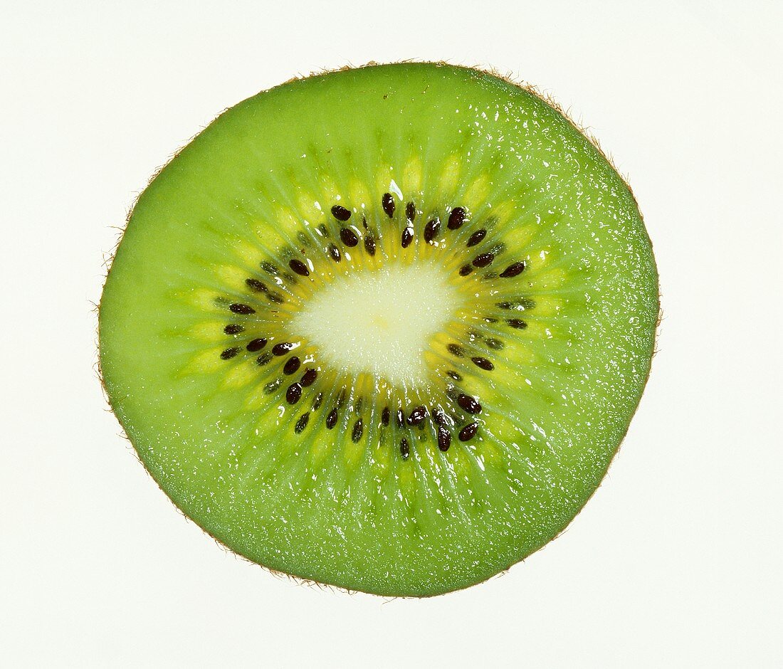Slice of kiwi fruit on white background